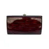 Foto de um(a) Clutch de Mão CGC Lucite Tartarura, da categoria de Bolsas. clutch vintage CGC, em lucite padrão tartaruga, ferragem em metal, fecho estilo vovó, não possui alça, compatível ao tamanho... Vendido no marketplace Trésors.