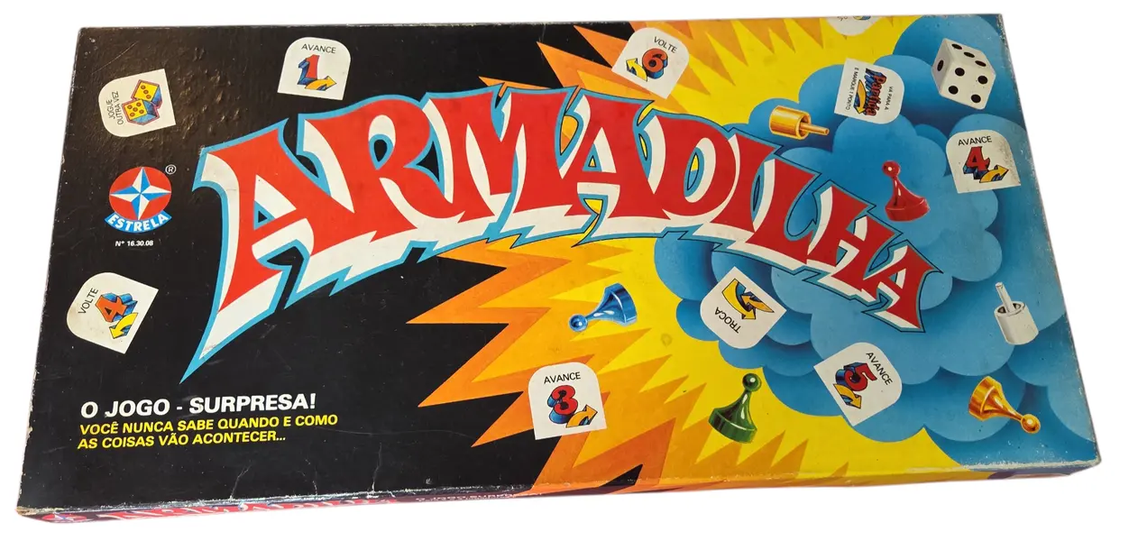 Foto de um(a) Armadilha - O Jogo de Tabuleiro (Estrela), da categoria de Jogos de tabuleiro. É um jogo de percurso e sorte onde você deve ser o primeiro a completar 12 pontos na sua trilha de marcação. A "armadilha"... Mostrado de uma perspectiva diferente. Vendido no marketplace Trésors.