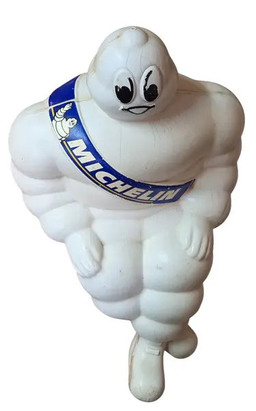 Foto de um(a) Boneco Michelin, da categoria de Bonecos de arte. Rara figura publicitária do icônico mascote da marca de pneus Michelin, o Bibendum. Este boneco apresenta o design clássico... Mostrado de uma perspectiva diferente. Vendido no marketplace Trésors.