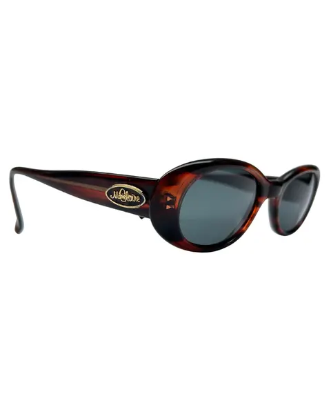 Foto de um(a) Óculos Vintage Marie Claire, da categoria de Óculos. Óculos VINTAGE Marie Claire, armação em acetato na cor marrom avermelhado, semi transparência, lentes escuras pretas. Seu... Mostrado de uma perspectiva diferente. Vendido no marketplace Trésors.