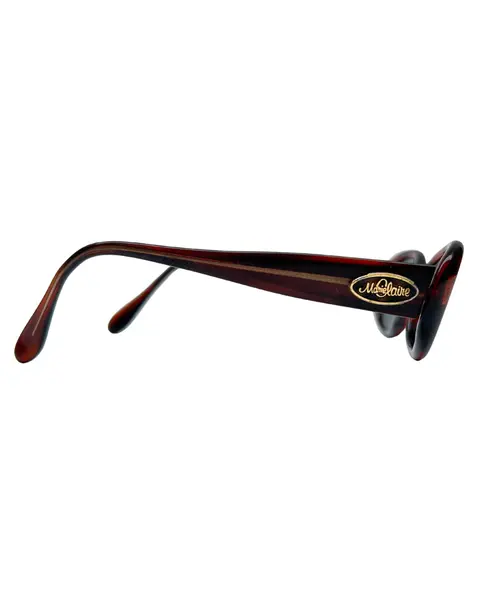 Foto de um(a) Óculos Vintage Marie Claire, da categoria de Óculos. Óculos VINTAGE Marie Claire, armação em acetato na cor marrom avermelhado, semi transparência, lentes escuras pretas. Seu... Mostrado de uma perspectiva diferente. Vendido no marketplace Trésors.
