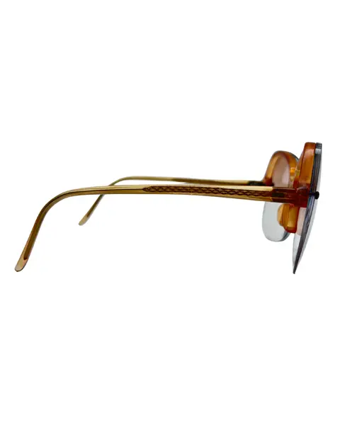 Foto de um(a) Armação Vintage Montmartre, da categoria de Óculos. Armação VINTAGE Montmartre, as lentes atuais possui em grau, em acetato marrom champanhe transparente , lentes claras/média... Mostrado de uma perspectiva diferente. Vendido no marketplace Trésors.