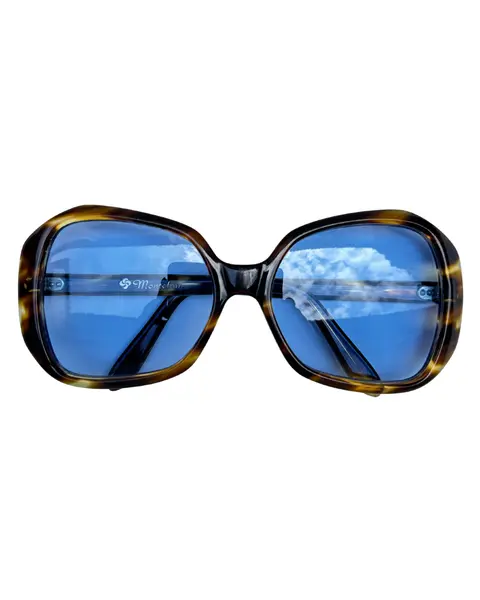 Foto de um(a) Óculos Vintage Novo Montclair Havana, da categoria de Óculos. Óculos VINTAGE Montclair, armação em acetato na cor padrão havana, semi transparência, lentes claras/média azulada. Seu... Vendido no marketplace Trésors.