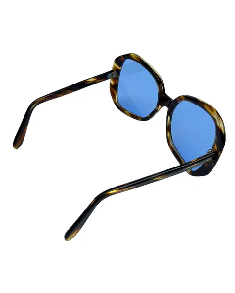 Foto de um(a) Óculos Vintage Novo Montclair Havana, da categoria de Óculos. Óculos VINTAGE Montclair, armação em acetato na cor padrão havana, semi transparência, lentes claras/média azulada. Seu... Mostrado de uma perspectiva diferente. Vendido no marketplace Trésors.