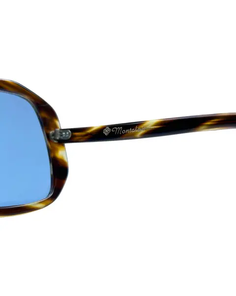 Foto de um(a) Óculos Vintage Novo Montclair Havana, da categoria de Óculos. Óculos VINTAGE Montclair, armação em acetato na cor padrão havana, semi transparência, lentes claras/média azulada. Seu... Mostrado de uma perspectiva diferente. Vendido no marketplace Trésors.