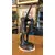 Foto de um(a) Escultura art nouveau em petit bronze, da categoria de Escultura. Linda escultura Art Nouveau, com 58cm de altura. Mostrado de uma perspectiva diferente. Vendido no marketplace Trésors.