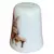 Foto de um(a) Dedal de Coleção em Porcelana - Estampa Casal de Coelhos e Coelhinho no Banco, da categoria de Outros colecionáveis. Este é um delicado dedal colecionável em porcelana branca, que apresenta uma temática lúdica e clássica de "Easter Bunnies"... Mostrado de uma perspectiva diferente. Vendido no marketplace Trésors.