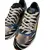 Foto de um(a) Tênis Shelter Retrô Colors Zebra, da categoria de Tênis. tênis Shelter, modelo retrô multi-estampas mix de cores, zebra e detalhes metálicos. Muito bom estado, praticamente sem uso.... Mostrado de uma perspectiva diferente. Vendido no marketplace Trésors.