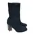 Foto de um(a) Bota Knit Louis Vuitton, da categoria de Botas. Bota Knit Louis Vuitton, saltos estrela com monogramas, italiana, em bom estado de conservação, porém foi retirada as tiras... Mostrado de uma perspectiva diferente. Vendido no marketplace Trésors.