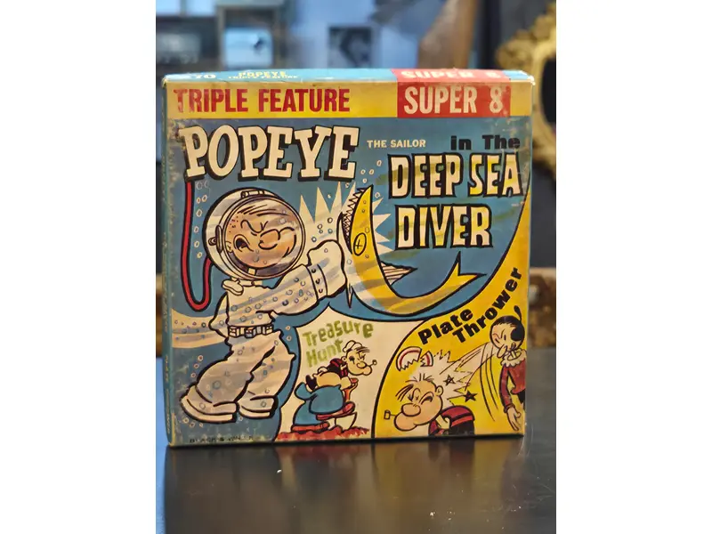 Foto de um(a) Filme Super 8 Popeye Deep Sea Diver, da categoria de Projetores. Filmes Super 8 americanos, originais de época, destinados a projeção e coleção. Peças que representam um importante capítulo... Mostrado de uma perspectiva diferente. Vendido no marketplace Trésors.